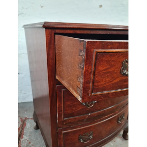 1008 - A Georgian style burr walnut miniature bow fronted chest of three drawers with cabriole supports - a... 