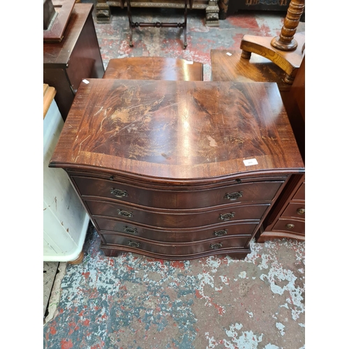 1015 - A Georgian style mahogany serpentine chest of four drawers with brushing slide - approx. 79cm high x... 