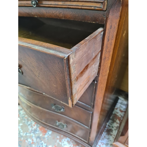 1015 - A Georgian style mahogany serpentine chest of four drawers with brushing slide - approx. 79cm high x... 