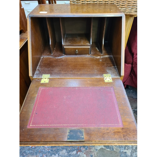 1029 - A Georgian style burr walnut effect narrow bureau with four drawers and fall front - approx. 102cm h... 