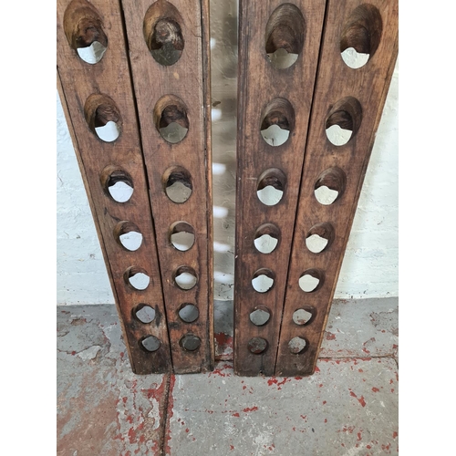 1039 - A pair of vintage reclaimed wood twenty bottle wine racks, one monogrammed 