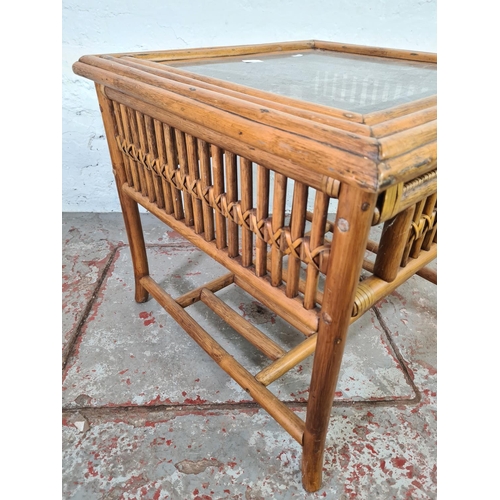 1052 - A bamboo and wicker two tier coffee table with glass insert - approx. 57cm high x 64cm wide x 64cm d... 