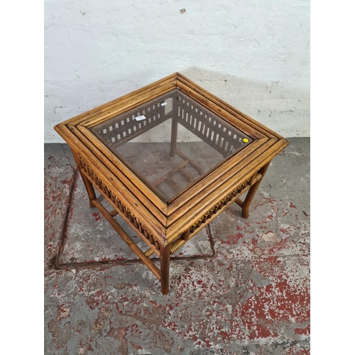 1052 - A bamboo and wicker two tier coffee table with glass insert - approx. 57cm high x 64cm wide x 64cm d... 