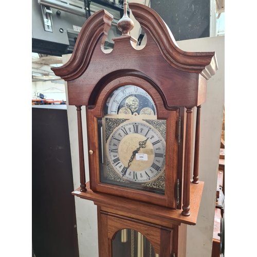 1059 - An oak and walnut grandfather clock with brass face, weights and pendulum - approx. 200cm high x 46c... 