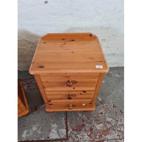 1061 - A pair of modern pine bedside chests of three drawers - approx. 66cm high x 46cm wide x 36cm deep