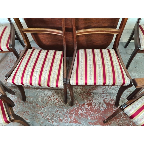 1065 - An oak effect drop leaf dining table and six Regency style mahogany dining chairs