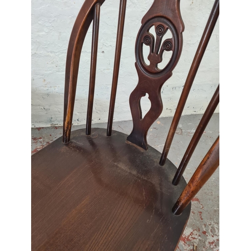 1073 - A pair of Ercol Fleur De Lys elm and beech dining chairs