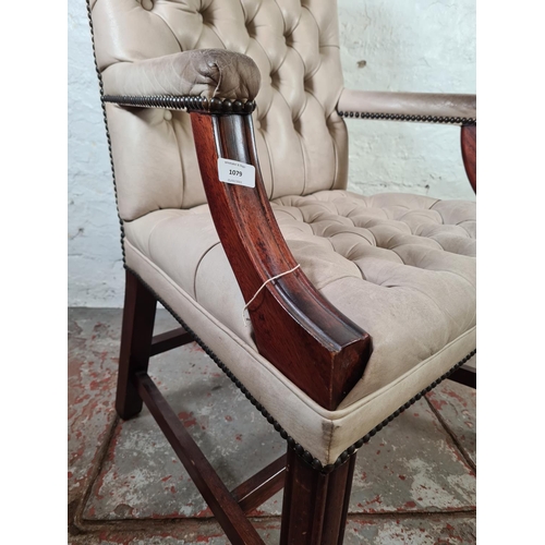 1079 - A mahogany and off white leatherette Gainsborough chair - approx. 101cm high x 65cm wide x 53cm deep