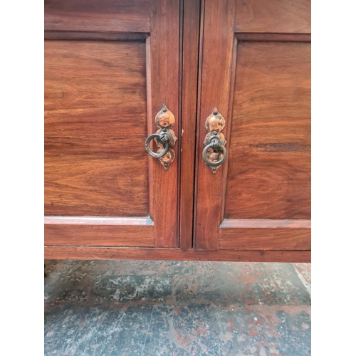 1080 - An Edwardian mahogany two door washstand with marble top - approx. 78cm high x 106cm wide x 46cm dee... 