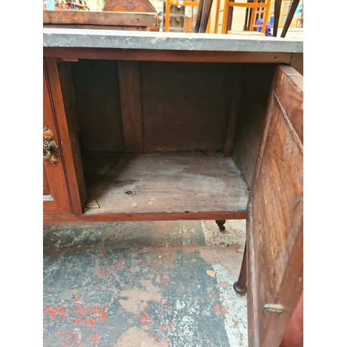 1080 - An Edwardian mahogany two door washstand with marble top - approx. 78cm high x 106cm wide x 46cm dee... 