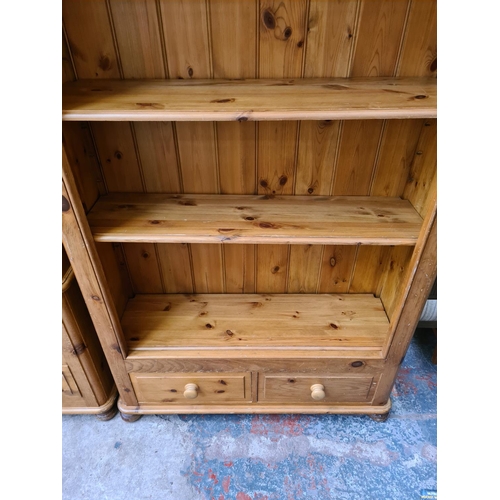 1084 - A modern solid pine four tier open bookcase with two lower drawers - approx. 201cm high x 105cm wide... 