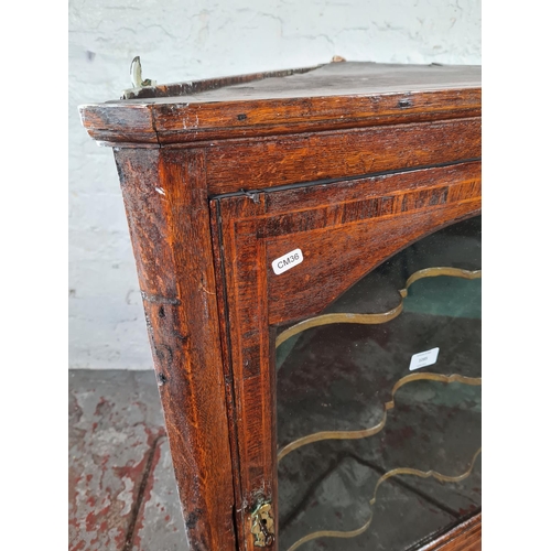 1085 - A George III oak wall hanging corner cabinet - approx. 85cm high x 67cm wide x 31cm deep