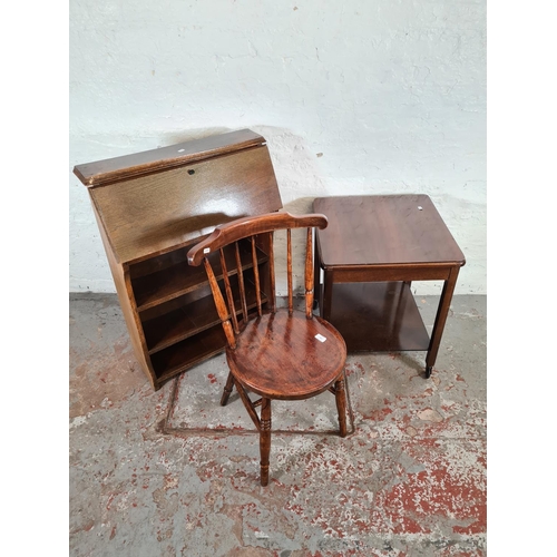 1103 - Three items of furniture, one elm and beech spindle back chair, one mahogany two tier tea trolley an... 