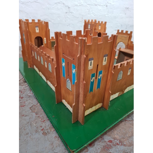 1104A - A wooden child's model castle - approx. 30cm high x 90cm wide x 90cm deep