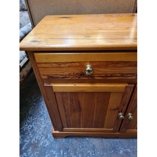 1115 - A modern pine sideboard - approx. 78cm high x 100cm wide x 46cm deep