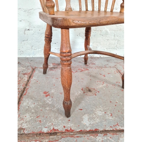 1120 - A Victorian elm smokers bow chair - approx. 69cm high x 53cm wide x 40cm deep