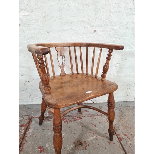 1120 - A Victorian elm smokers bow chair - approx. 69cm high x 53cm wide x 40cm deep