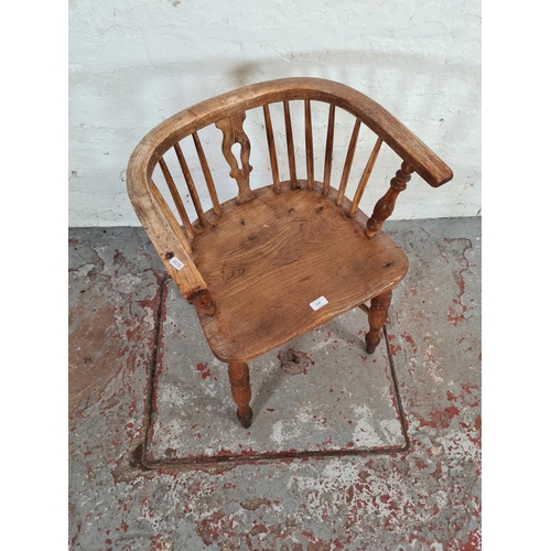 1120 - A Victorian elm smokers bow chair - approx. 69cm high x 53cm wide x 40cm deep