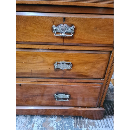 1122 - An Edwardian walnut chest of two short over two long drawers - approx. 84cm high x 121cm wide x 49cm... 