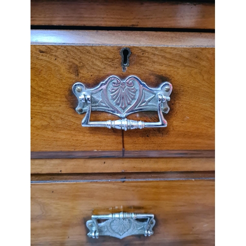 1122 - An Edwardian walnut chest of two short over two long drawers - approx. 84cm high x 121cm wide x 49cm... 