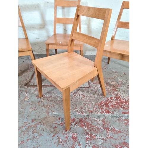 1125 - A set of four contemporary beech dining chairs