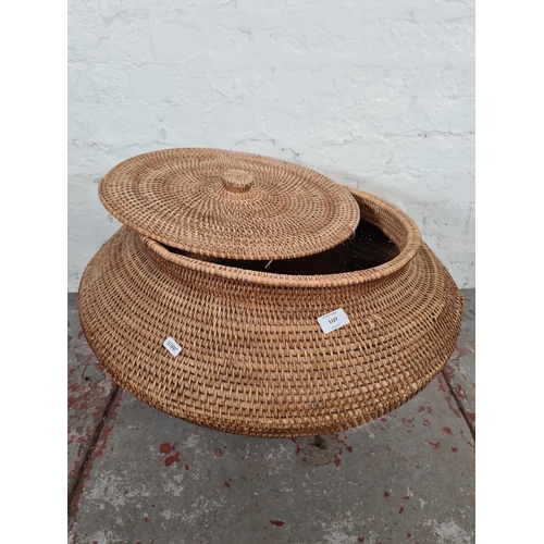 1127 - A wicker lidded basket - approx. 47cm high