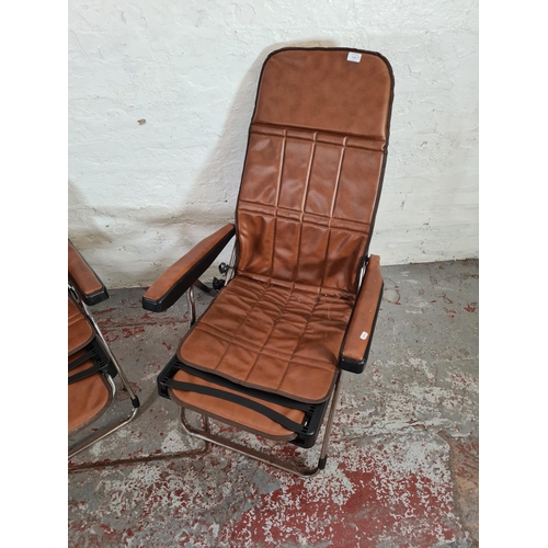 1132 - A pair of Italian brown leatherette folding deck chairs