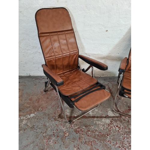 1132 - A pair of Italian brown leatherette folding deck chairs