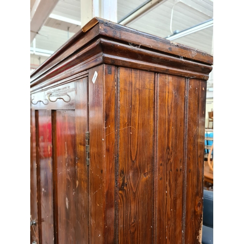 1134 - A late 19th/early 20th century pine school cupboard - approx. 187cm high x 153cm wide x 38cm deep