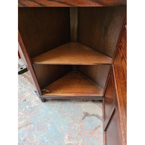 1157 - A Jaycee oak freestanding corner cabinet - approx. 184cm high x 69cm wide x 32cm deep