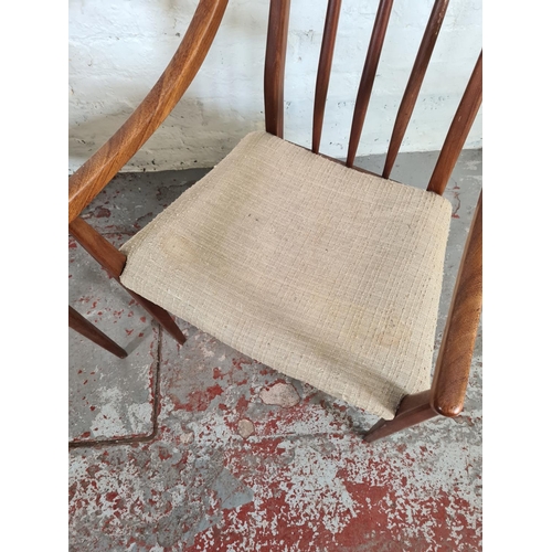 1169 - A pair of mid 20th century teak carver dining chairs