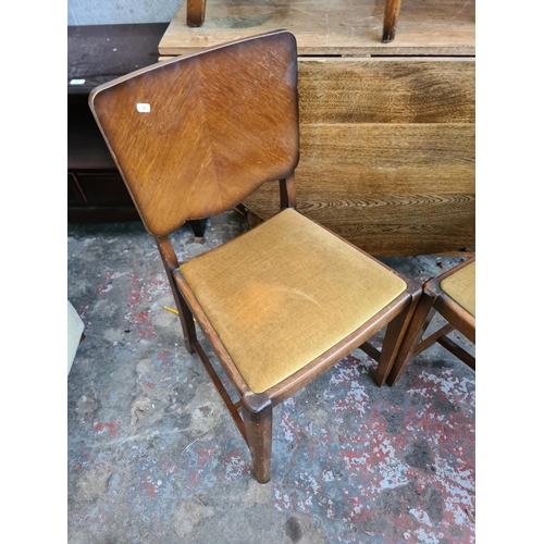 1198 - An oak drop gate leg dining table with four matching chairs