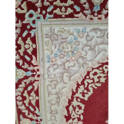 1217 - An Indian red and white rug - approx. 287cm x 187cm