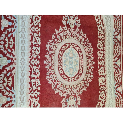 1217 - An Indian red and white rug - approx. 287cm x 187cm