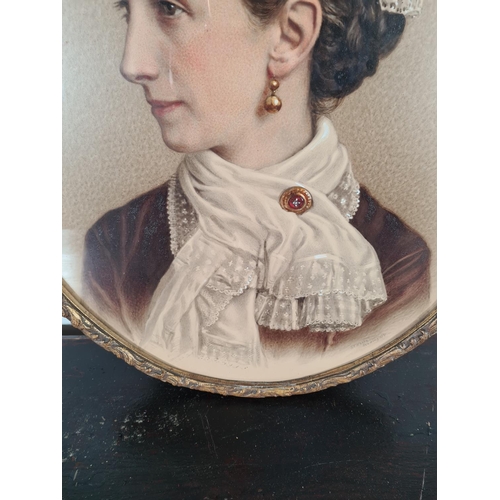 1233 - A Victorian gilt framed oval portrait of a lady signed S. V. White, Reading, dated 1880 - approx. 66... 