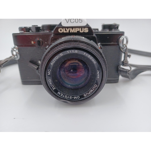 1251 - An Olympus OM-1N 35mm SLR camera fitted with Olympus OM System Zuiko MC Auto-S 1:1.8 f=50mm lens