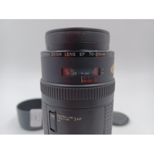 1261 - A Canon EF 70-210mm 1:4 zoom lens with caps, filter and hood