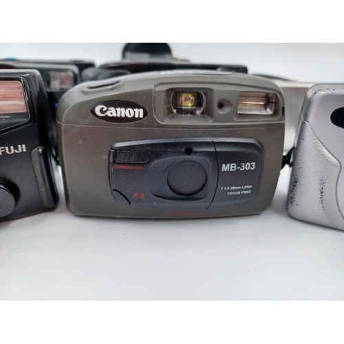 1263 - A collection of seven compact cameras to include Canon MB-303, Canon Sure Shot Z155, Fuji DL-1000 Zo... 