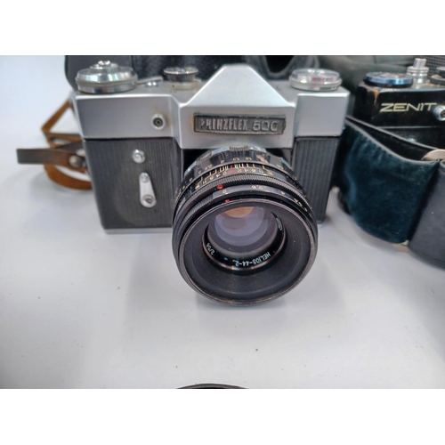 1269 - Four cased vintage 35mm SLR cameras, one part cased Zenit EM fitted with Pentacon auto 1.8/50 lens, ... 