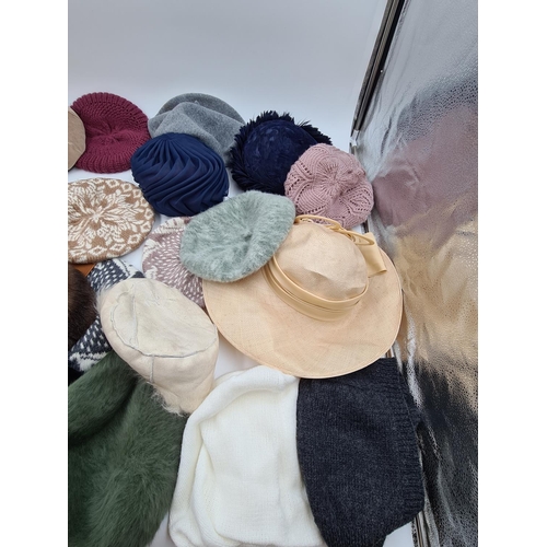 567 - A collection of assorted ladies hats to include Kangol etc.