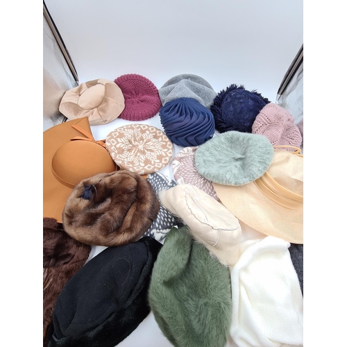 567 - A collection of assorted ladies hats to include Kangol etc.