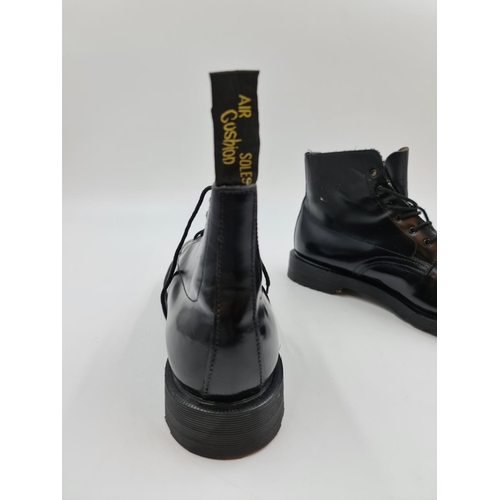 568 - A pair of Dr. Martens Black Derby leather boots, size EU 31/UK 12.5