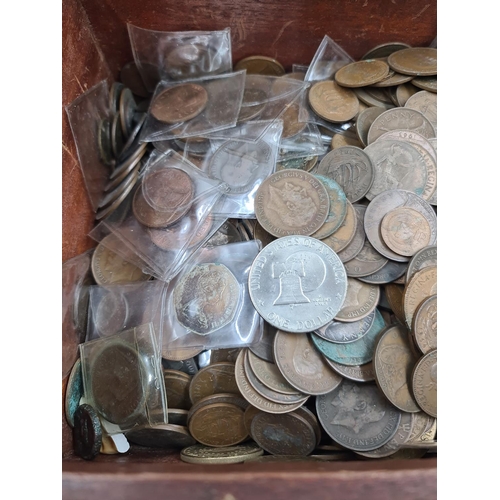 585 - A vintage Gecophone mahogany box containing assorted British coins