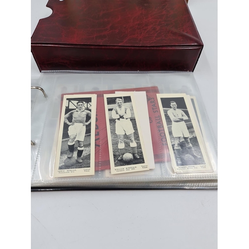 586 - A collection of vintage cigarette cards and photographs to include 1930s Topical Times Stars of Toda... 