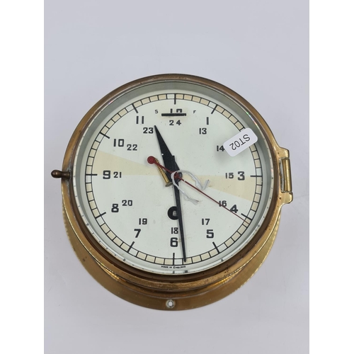 625 - A vintage English brass cased ships type radio room clock with bevelled glass front - approx. 20cm i... 