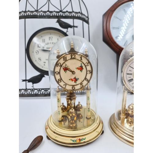 639 - Six assorted clocks and barometers to include novelty ships wheel barometer, Kundo anniversary clock... 