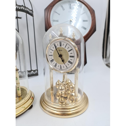 639 - Six assorted clocks and barometers to include novelty ships wheel barometer, Kundo anniversary clock... 