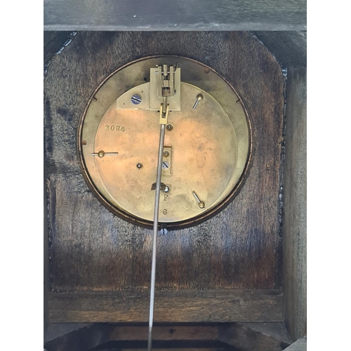 648 - A Victorian walnut and ebonised key wind mantel clock with white enamel face and pendulum - approx. ... 