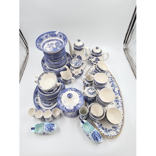 470 - A large collection of assorted blue and white china to include Willow pattern teapot, coffee pot and... 