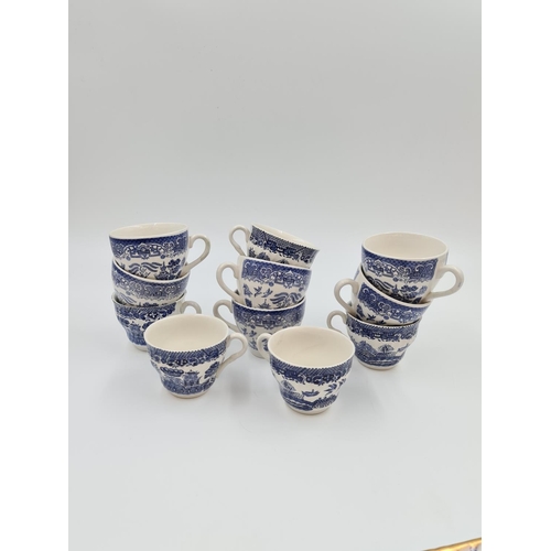 470 - A large collection of assorted blue and white china to include Willow pattern teapot, coffee pot and... 